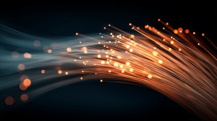 Glowing fiber optic light strands fanning out with warm bright tips against deep indigo-black background, abstract tech energy scene.