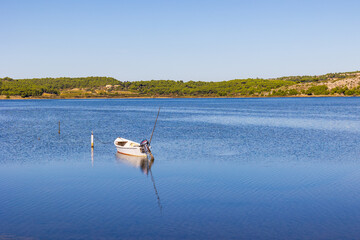 Small fishing boat moored on the Gruissan lagoon