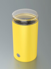 Yellow electric coffee grinder on grey metal table
