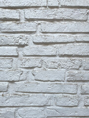 White brick wall texture with rough, uneven surface and natural imperfections.Bright painted masonry background ideal for design projects,architecture,interiors, patterns,and high-resolution textures
