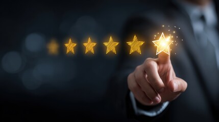 Hand selecting perfect rating from glowing stars