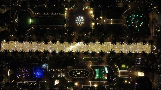 Zenith view of Pra&ccedil;a da Liberdade at night, beautifully illuminated with Christmas lights, showcasing festive decorations, movement of people and vibrant holiday atmosphere in Belo Horizonte, Brazil