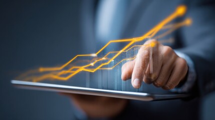 Hand touching glowing stock chart on tablet