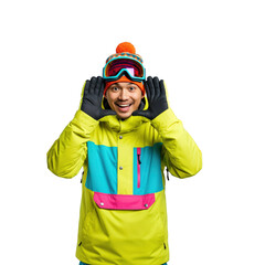 Fototapeta premium Young Asian man in vibrant ski jacket and orange beanie, wearing goggles on forehead, smiling cheerfully and framing his face with hands, isolated on black.