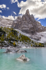 Beautiful Lake Sorapis in Dolomites, popular travel destination in Italy. Turquoise lake in Mountain. Vertical photo.