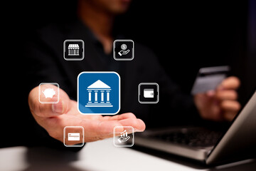 A hand presents digital banking icons above a laptop, illustrating online finance and modern banking solutions in a tech-driven environment.