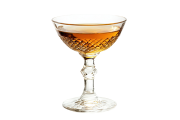 Elegant amber cocktail in a coupe glass isolated on transparent background. Martini isolated on white background.