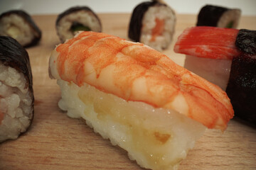 Sushi fish served with rice salmon crab and crayfish                               