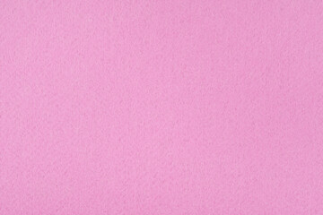 Light pink felt background - close-up of the soft surface of the fabric. Seamless background, graphic design, scrapbooking, textile layouts, creative projects.