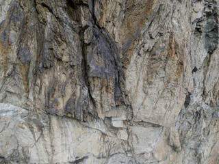 Rugged Cliff Face With Jagged Granite Rocks In A Natural Quarry Scene
