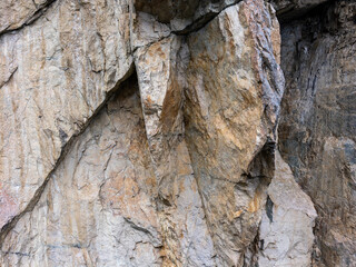 Rugged Cliff Face With Jagged Granite Rocks In A Natural Quarry Scene