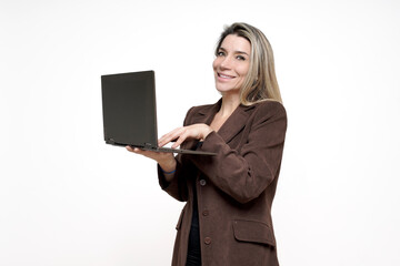 Businesswoman smiling, typing on laptop, presenting new online solution
