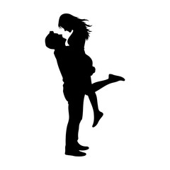 Silhouette of a man lifting a woman with one leg raised in the air