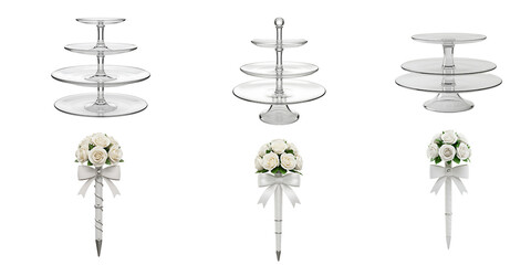 Elegant tiered silver dessert stands adorned with delicate white floral arrangements and satin ribbon bows on a black background