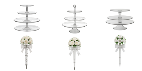 Elegant tiered silver dessert stands adorned with delicate white floral arrangements and satin ribbon bows on a black background