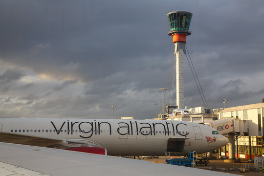 Control Tower and Airplane wing in Heathrow International Airport in London, England