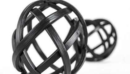 Abstract black woven spherical objects, one in focus and one blurred, on an isolated transparent background, representing modern design.