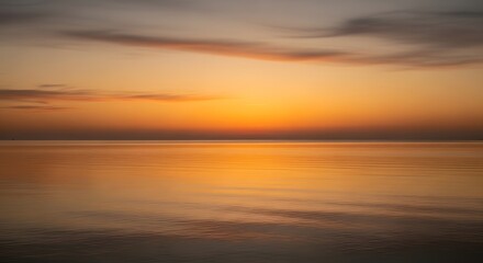 Obraz premium 🌅 Golden Sunset Reflection over the Ocean Waves at the Beach Coast