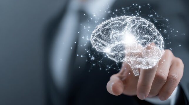 Hand touching digital brain with glowing connections