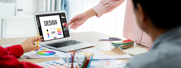 Graphic designer software for modern design of web page and commercial brisk ads showing on the computer screen