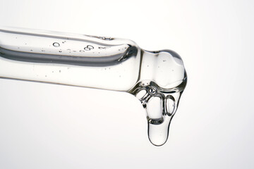 Cosmetic pipette dispensing clear serum or facial oil