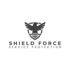 The dynamic logo for a security company. It features a powerful red eagle with its wings spread, symbolizing vigilance and protection. The eagle is set against a bold, modern black shield shape.