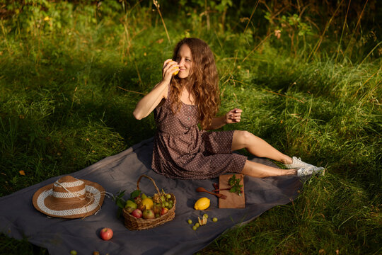 Female relaxing outside while tasting freshly made confectionery - Powered by Adobe