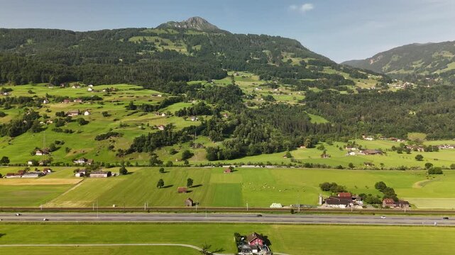 Aerial Panorama of Lush Swiss Valleys and Majestic Mountains near Flums, Berschis, and Walenstadt