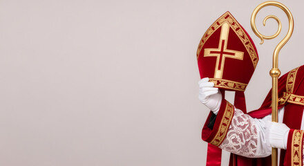 Obraz premium Red sinterklaas hat Mitre, decorative staff, festive attire and dutch holiday spirit. traditional Saint Nicolas day five december. Sinterklaas greeting card. Festive day in Netherlands, Belgium