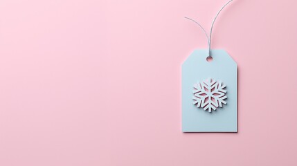 Minimal pastel blue shopping tag with snowflake isolated on clean powder pink background, cutout soft design, Christmas sale concept