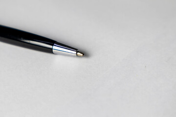 Black business pen on white background