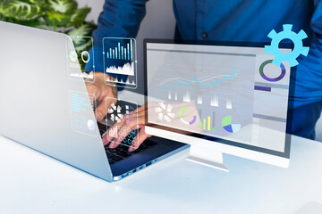 Businessmen work by controlling various systems through digital screens in their technology work.