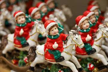 Christmas toys, boys on horses figurines. New Year souvenirs in a superstore