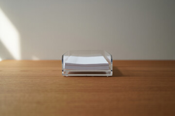 Clear Acrylic Paper Tray Organizer for Holding Stationery on Wooden Surface at Workplace with Bright Lighting in Comfortable Office