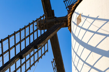 Mota del Cuervo windmill blades casting shadow on white wall