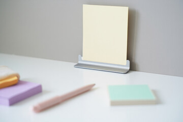 Sticky Note on Metal Holder With Pen and Additional Blank Paper Stationery Office Work Desk Organization Reminder Message Task