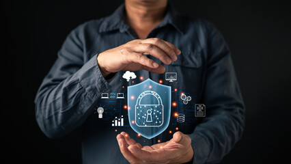 Man hands holding shield padlock hologram with cloud and network icons. Cybersecurity concept for data protection, privacy safety, digital defense, and secure internet technology system.