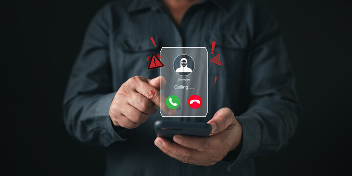 Man hand holding phone receiving unknown scam call with hacker hologram. Cyber security concept showing incoming fraud alert, voice phishing danger, identity theft, and digital crime warning.