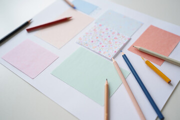 Colorful Pastel Swatches with Pencils on White Background for Creative Design and Artistic Inspiration on Desktop