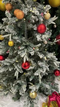 4k footage of christmas santa claus and christmas tree decoration with twinkle lights and interactive spotlights. Christmas pop up ornaments and decoration