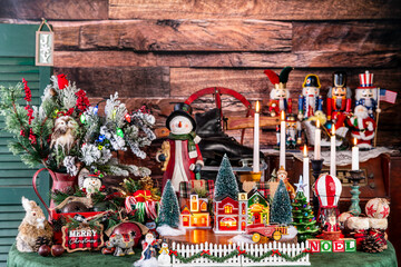 maximalist Christmas village surrounded by vintage toys and classic Christmas decorations