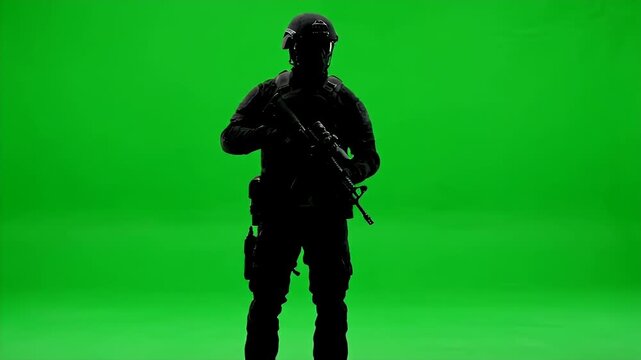 Special Forces Soldier in Tactical Gear Walking and Aiming on Green Screen.