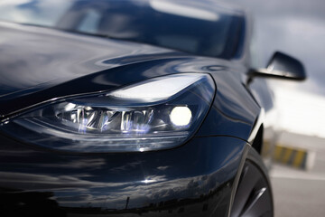 Modern car headlamp flashing light with blinking on continuously indicator. Switched on led matrix lights of luxury car. Car Blinker Light. Car front full led matrix Light