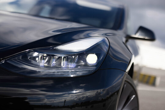 Modern car headlamp flashing light with blinking on continuously indicator. Switched on led matrix lights of luxury car. Car Blinker Light. Car front full led matrix Light