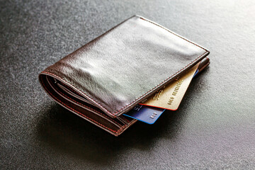 Various currencies in purse close-up.Open wallet with euro banknotes.British coins , pound sterling.Dollars cash and credit cards.Finance concept