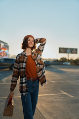 Woman smile urban shopping scene at golden hour, candid lifestyle portrait with authenticity and golden hour glow, mindful living vibe and emotional storytelling in a relaxed city moment.