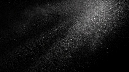 An artistic representation of scattered dust particles on a black background, creating a beautiful, etherial effect. A stunning visual for creative purposes.
