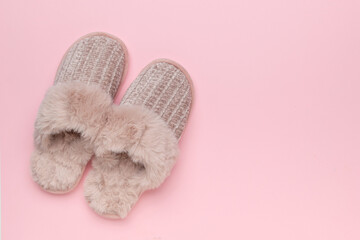Cozy Furry Slippers on Pastel Pink Background for Relaxation and Comfort