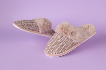 Cozy Furry Slippers on Pastel Background - Warm and Stylish Footwear for Comfort at Home