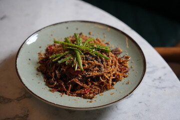 Authentic Thai noodles served in a bowl with fresh vegetables, herbs, lime, and traditional spices. Asian street food style, vibrant colors, close-up, high-resolution